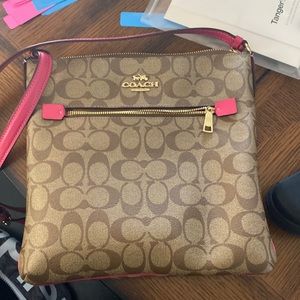 Coach Rowan crossbody in brown/bold pink with gold accents